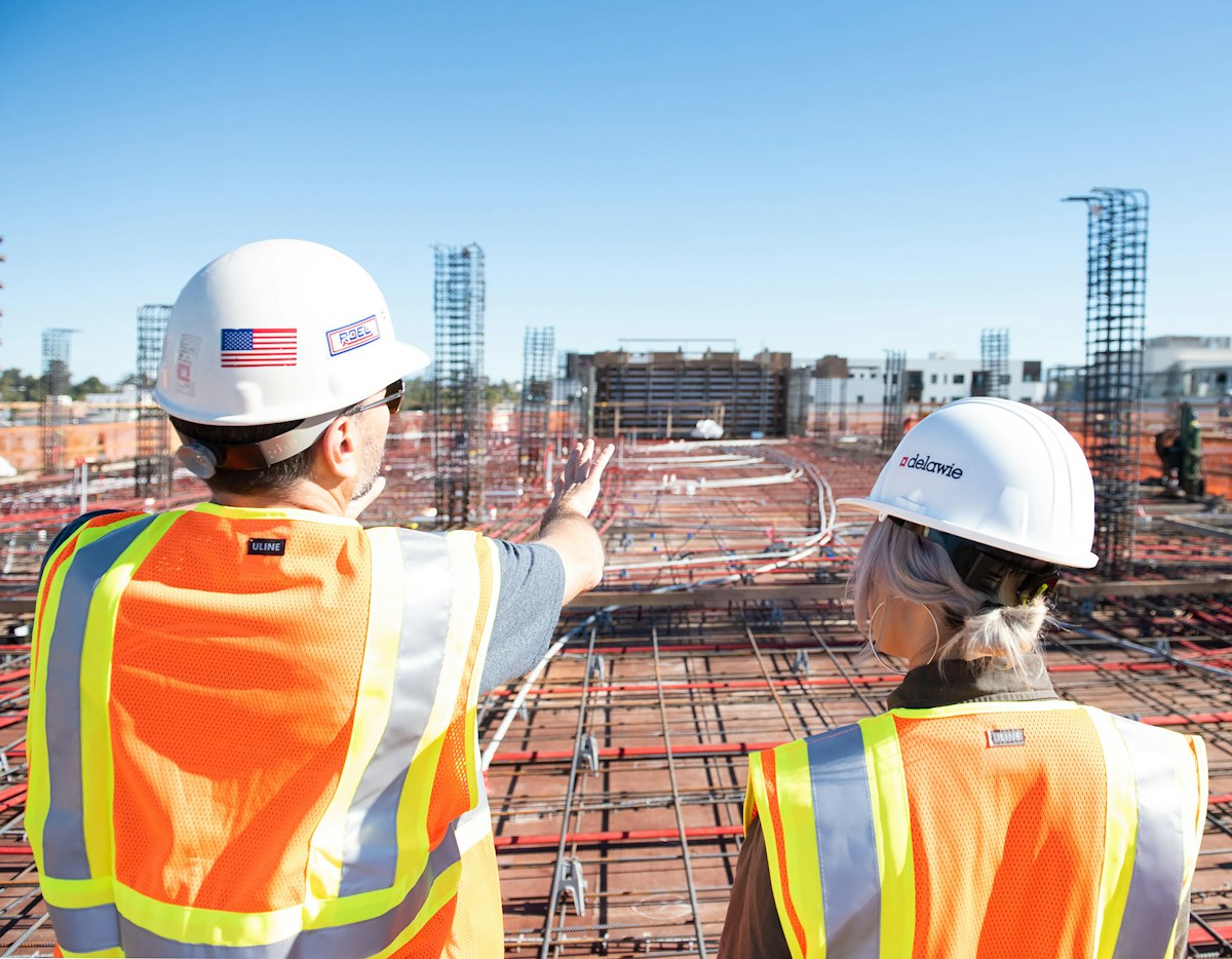 Construction professionals coordinating on-site work